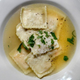 Ravioli in parmesan broth